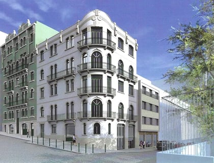 Classical corner building of Almirante Tridente in Lisbon — white façade with wrought-iron balconies