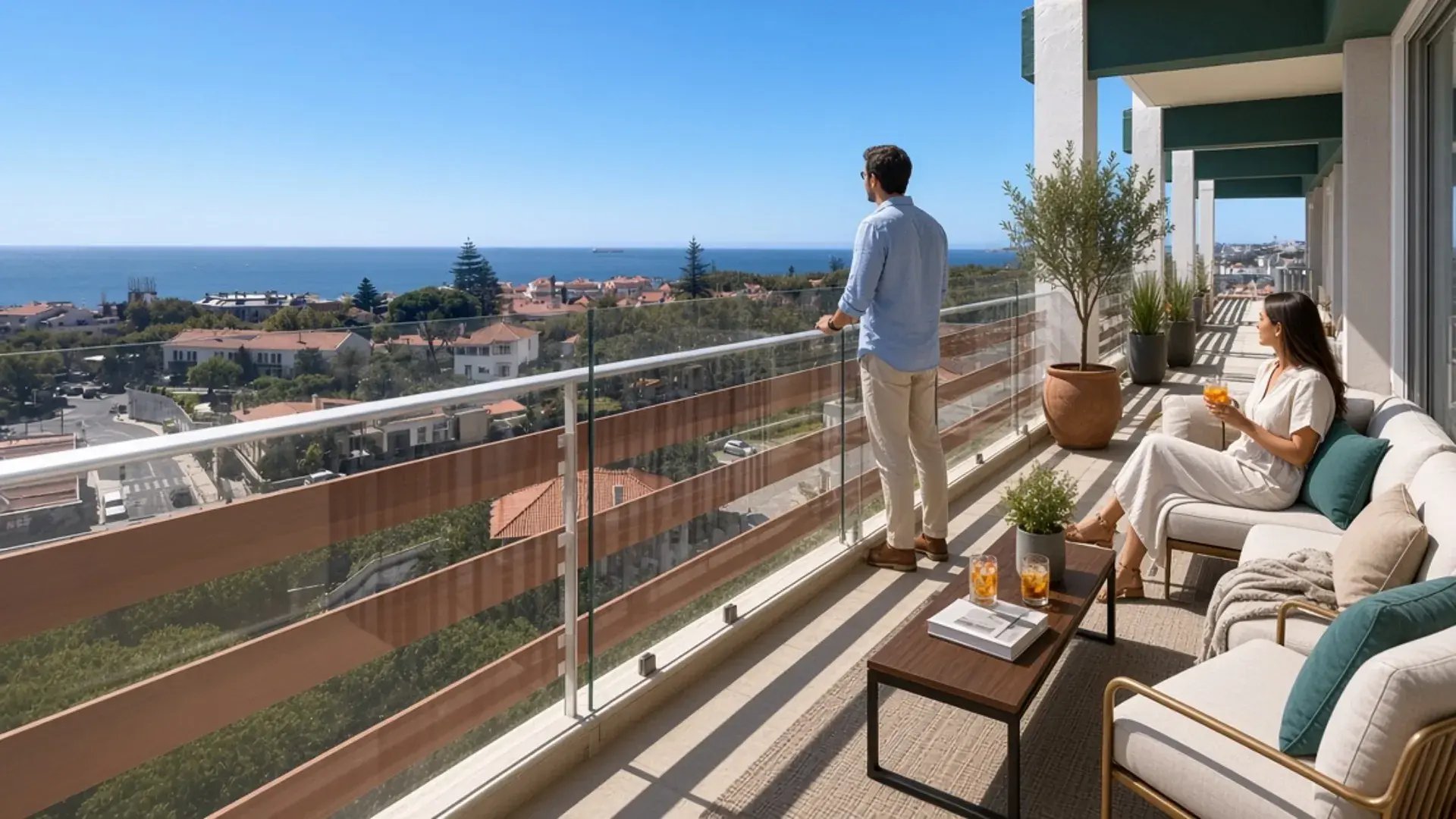 South terrace of a top-floor penthouse in Parede, with lounge seating and an open view of the Atlantic
